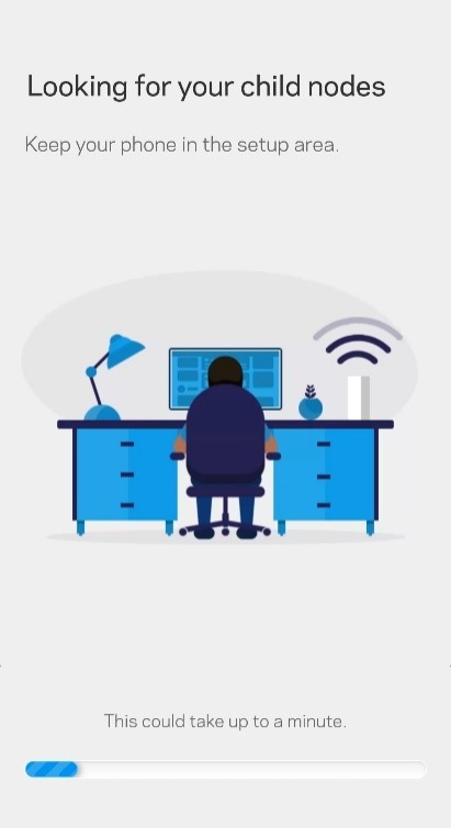 A person sitting at a desk with a computerDescription automatically generated